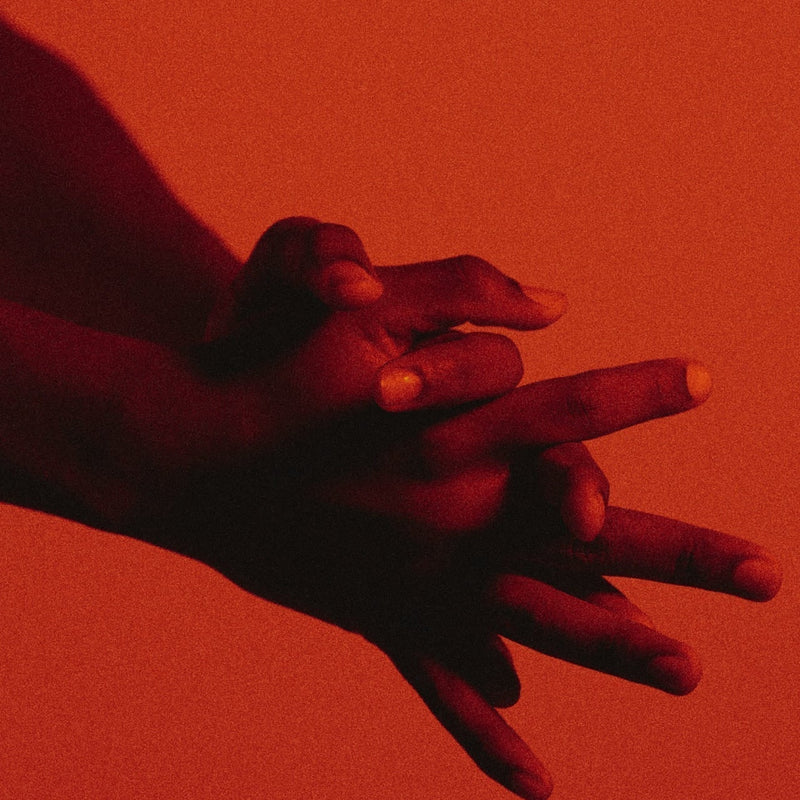 MANS HANDS IN RED LIGHT
