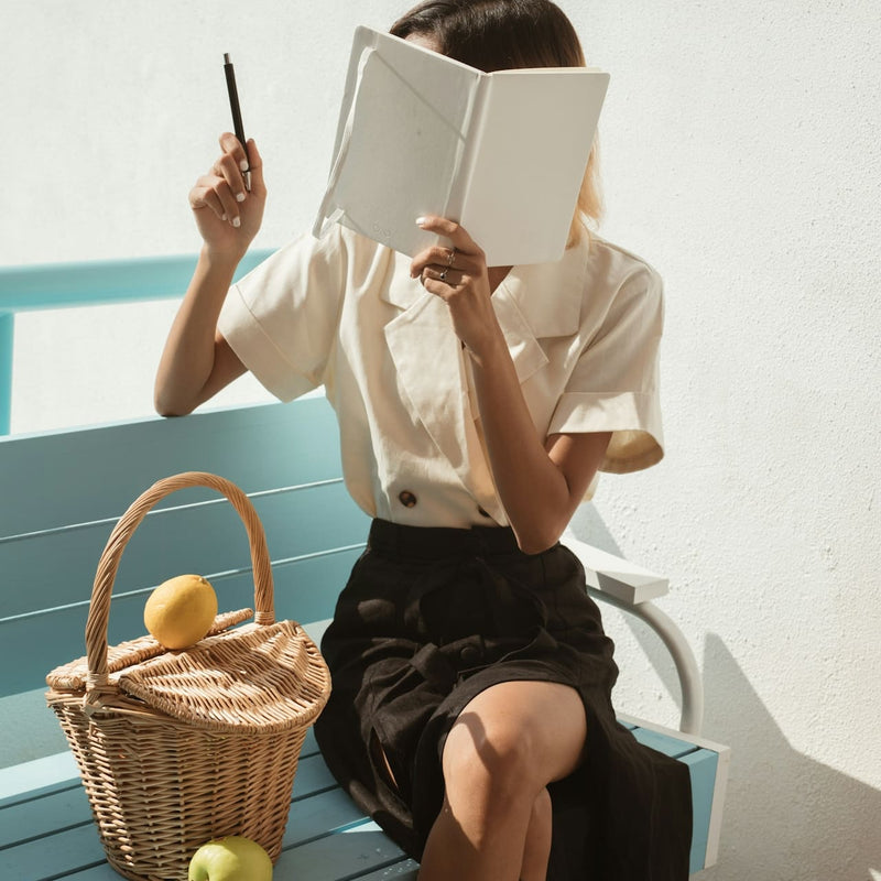 WOMAN READING A BOOK