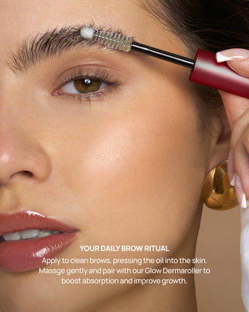 Woman applying brow oil with a brush to her eyebrow, with text about a daily brow ritual.