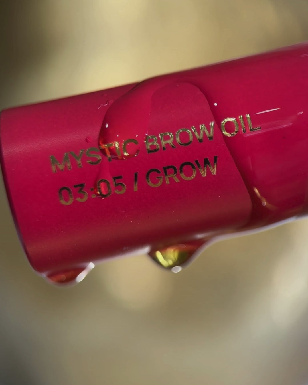Video of brow oil slowly dripping over the bottle.